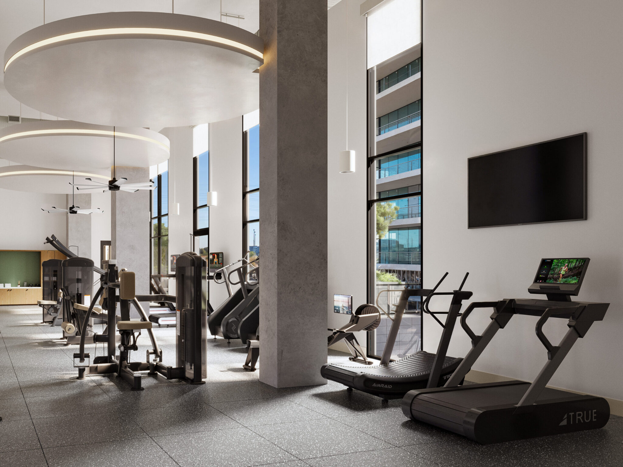 Well-lit gym with weightlifting stations